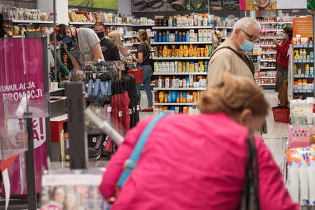 WROCLAW, POLAND - MAY 22, 2020. People with face masks dDue to coronavirus pandemic in the shop.