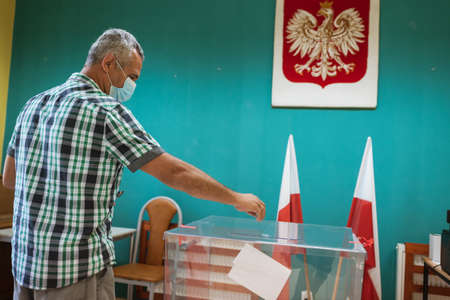 SCINAWA, POLAND - JUNE 28, 2020: The voter during elections for president of Poland.のeditorial素材