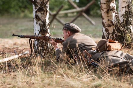 LUBIN, POLAND - AUGUST 8, 2020:, A staging of the Battle of Warsaw from 1920, in which the Polish army defeated the Bolshevik aggression. Polish shooter.のeditorial素材