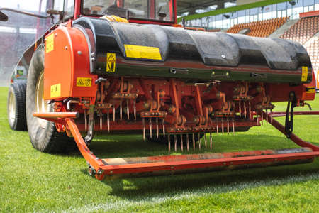 Detail of aeration machine during grasslands football field