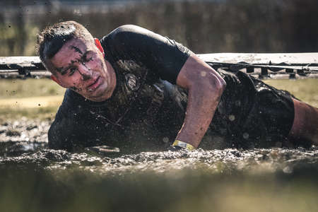 WROCLAW, POLAND - APRIL 7; 2018: Extreme running with obstacle RUNMAGEDDON. In the picture a runner on the Recruit route.のeditorial素材