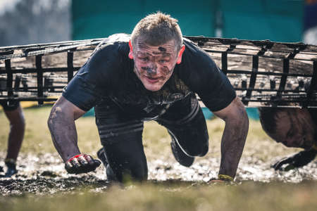 WROCLAW, POLAND - APRIL 7; 2018: Extreme running with obstacle RUNMAGEDDON. In the picture a runner on the Recruit route.のeditorial素材