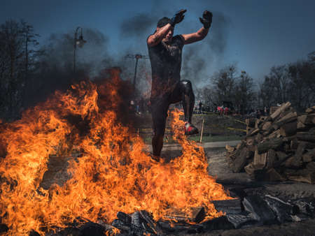 WROCLAW, POLAND - APRIL 7; 2018: Extreme running with obstacle RUNMAGEDDON. In the picture a runner on the Recruit route.のeditorial素材
