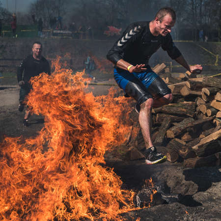 WROCLAW, POLAND - APRIL 7; 2018: Extreme running with obstacle RUNMAGEDDON. In the picture a runner on the Recruit route.のeditorial素材