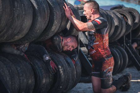 WROCLAW, POLAND - APRIL 7; 2018: Extreme running with obstacle RUNMAGEDDON. In the picture a runner...