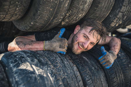 WROCLAW, POLAND - APRIL 7; 2018: Extreme running with obstacle RUNMAGEDDON. In the picture a runner on the Recruit route.のeditorial素材