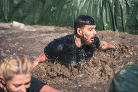 WROCLAW, POLAND - APRIL 7; 2018: Extreme running with obstacle RUNMAGEDDON. In the picture a runner on the Recruit route.のeditorial素材
