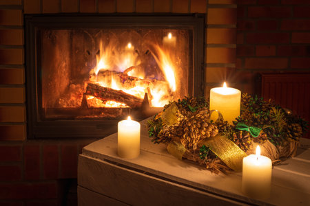 Christmas floral decoration in front of firepace.の写真素材