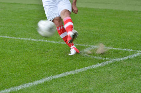 Player knicks the ball from the corner - intentional blur.