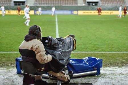 Cameraman near playing field during soccer match.のeditorial素材