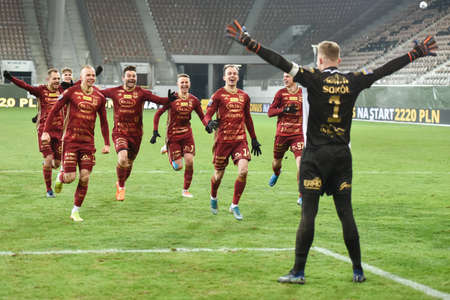 LUBIN, POLAND - FEBRUARY 11, 2021: Football match Fortuna Polish Cup between KGHM Zaglebie Lubin - Chojniczanka Chojnice 0: 0 (4: 5). Joy team of Chojniczanka with goalkeeper Pawel sokol after penalty shoots.のeditorial素材
