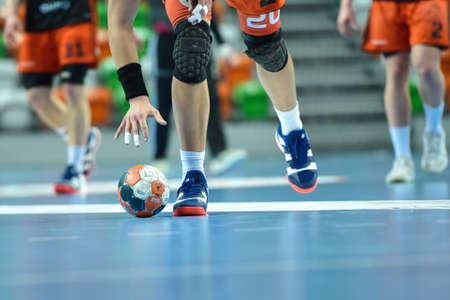 LUBIN, POLAND - MARCH 13, 2019: Polish PGNiG Superleague men in handball match between MKS Zaglebie Lubin - Energa Wybrzeze Gdansk 29:25. Player raises the ball.のeditorial素材