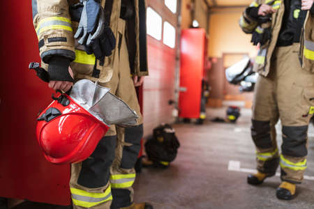 Red helmet in fireman's handの写真素材