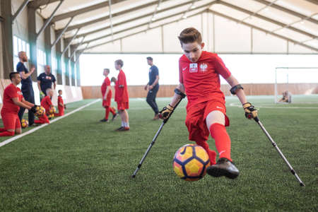 MACHNICE, POLAND - APRIL 6, 2019: Training of National Junior AMP Football team during grouping of children and adolescents after amputations and with limb defects.のeditorial素材