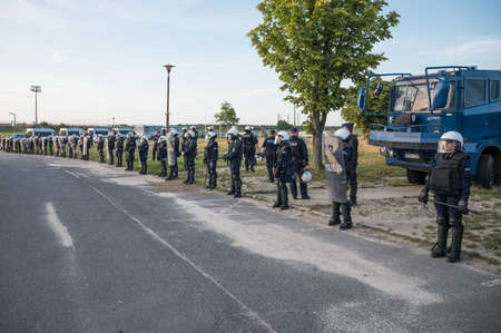 LUBIN, POLAND - SEPTEMBER 15, 2021: Police waiting for football supporters in front of the stadium before Ekstraklasa football match KGHM Zaglebie Lubin - Pogon Szczecin.のeditorial素材