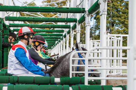 WROCLAW, POLAND - OCTOBER 16; 2021: Race for three five years old horses and older at Racecourse WTWK Partynice. Competitors into start machine.のeditorial素材