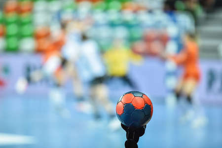 Detail of handball ball and match in the background.の写真素材