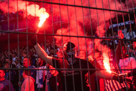 POZNAN, POLAND - MAY 21, 2022: Football match Polish PKO Ekstraklasa between Lech Poznan vs KGHM Zaglebie Lubin 2: 1. Supporters of Lech burns flares.のeditorial素材