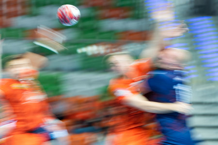 Blurred handball players struggling during handball matchの写真素材