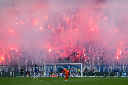 POZNAN, POLAND - FEBRUARY 19, 2023: Football match Polish PKO Ekstraklasa between Lech Poznan vs KGHM Zaglebie Lubin 1:2. Supporters of Lech burns flares.のeditorial素材
