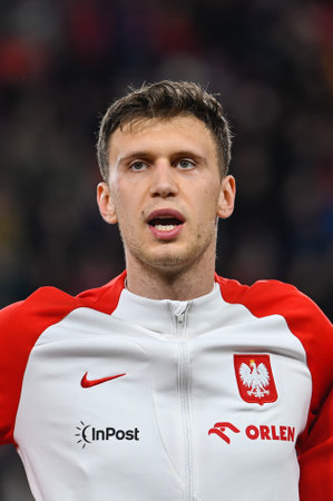 PRAGUE, CZECH REPUBLIC - MARCH 24, 2023: Qualifications for UEFA Euro 2024. Match Czech Republic - Poland 3:1. Krystian Bielik during anthem.のeditorial素材