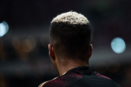 the back of the football player's head with his hair painted whiteの写真素材