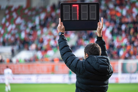 Technical referee shows added time during football match.の写真素材