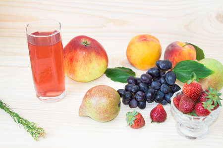 Fresh fruits. Healthy food. Mixed fruits are grapes, pears, peaches, strawberries. eat, diet, like fruit. Studio of various fruits on an old wooden table. Organic healthy assorted fruits. Assortment of fresh fruits. . Fruit food background.の写真素材