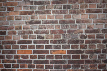 stone wall pattern natural surface.Old brick wall - grunge background. The texture of the painted old bricks is dark red and brown, shabby.の写真素材