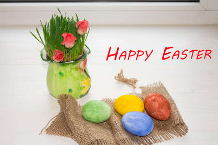 Easter eggs in the grass against a blurred green background. Spring vacation conceptの写真素材