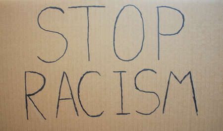 STOP RACISM. Text message for protest on cardboard. Stop racism. Police violence. Banner Design...