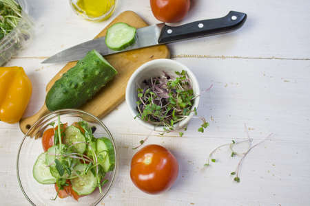 microgreen. Sprouts of vegetables sprouted from the seeds of plants. Microgreen salad cooking concept on a white background. copyspaceの写真素材