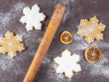 Delicious homemade gingerbread. Gingerbread cookies on a rusty wooden background. Cooking gingerbread. Christmas.の写真素材