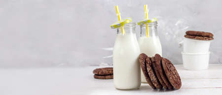 Tasty fresh milk on a white wooden background. a glass of milk. Banner. copy spaceの写真素材
