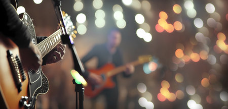 Hands of a guitarist with a guitar on stage. Banner. wallpaper. Generated AIの素材