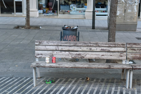 Sabadell, SPAIN - 06/24/2020: trash on the ground around waste containers at Sant Roc squareのeditorial素材