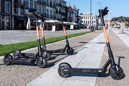 Vila Nova de Gaia, PORTUGAL - 11/07/2020: rental scooters from Circ company parked near Douro river promenadeのeditorial素材
