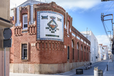 Sabadell - Catalonia, SPAIN - January 31st of 2021: facade of the public school Enric Casassas with mosaic with city coat of armsのeditorial素材