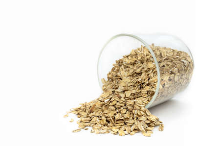 oat groats on white backgroundの写真素材