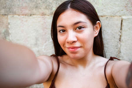 selfie of an asian woman in the streetsの写真素材