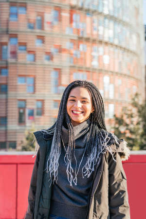 Positive Hispanic woman on street