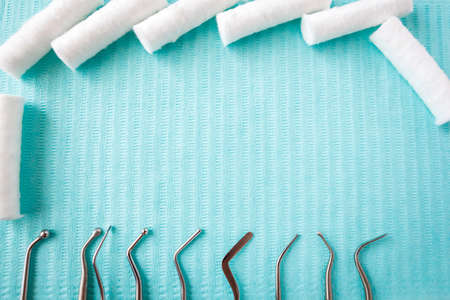 dental cotton rolls, instruments on the napkin. Top view with copy space for text. Dentist equipment, Stomatologyの写真素材