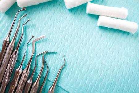 dental cotton rolls, instruments on the napkin. Top view with copy space for text. Dentist equipment, Stomatologyの写真素材