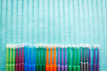 Disposable dental microbrush micro applicator - restorative dental product. Top view with copy space for text.の写真素材