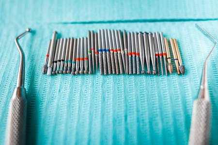 dental instruments on blue napkin. Top view with copy space for textの写真素材