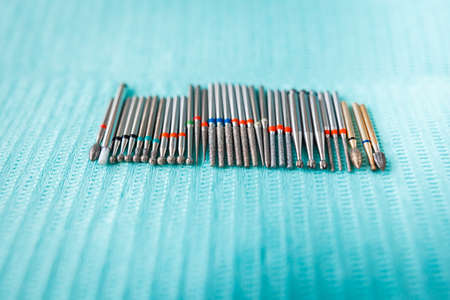 dental instruments on blue napkin. Top view with copy space for textの写真素材
