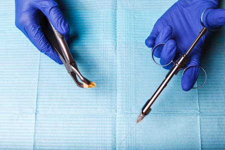 dental and endodontic instruments in hands. Top view.の写真素材