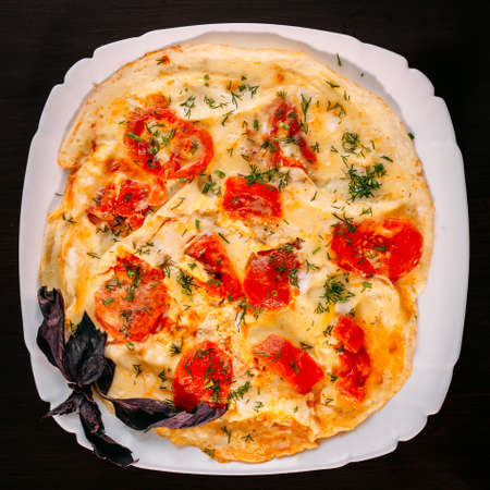 European international fusion cuisine, a beautiful dish on a white plate decorated with herbs and...