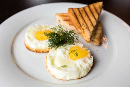 European international fusion cuisine, a beautiful dish on a white plate decorated with herbs and...
