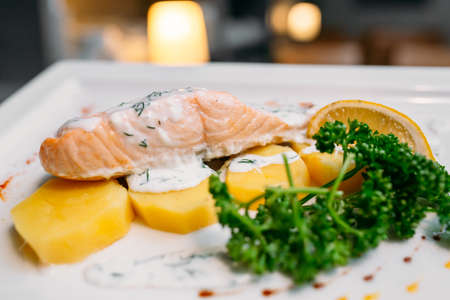 European international fusion cuisine, a beautiful dish on a white plate decorated with herbs and...